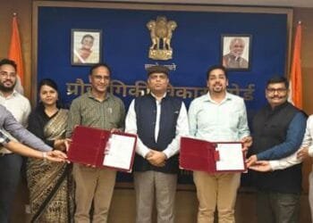 TDB-DST and Indigenous Energy officials with signed document supporting commercializing of batteries.