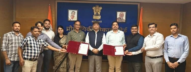 TDB-DST and Indigenous Energy officials with signed document supporting commercializing of batteries.