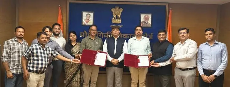 TDB-DST and Indigenous Energy officials with signed document supporting commercializing of batteries.