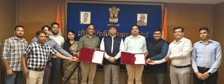 TDB-DST and Indigenous Energy officials with signed document supporting commercializing of batteries.